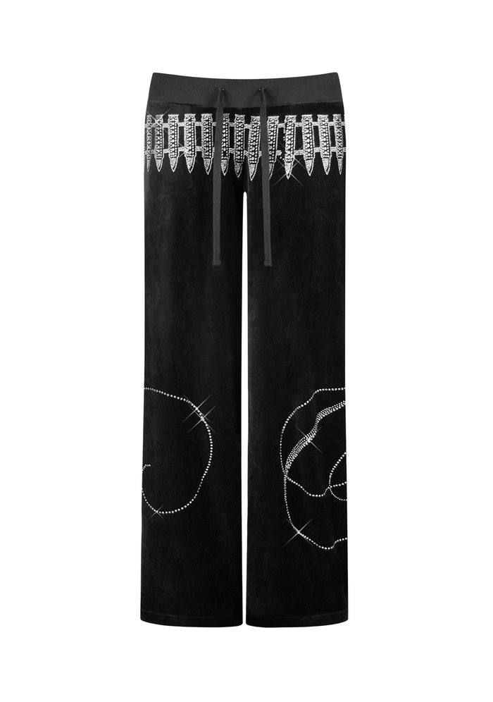 Front view of black velour sweatpants featuring rhinestone logo and embellishments.