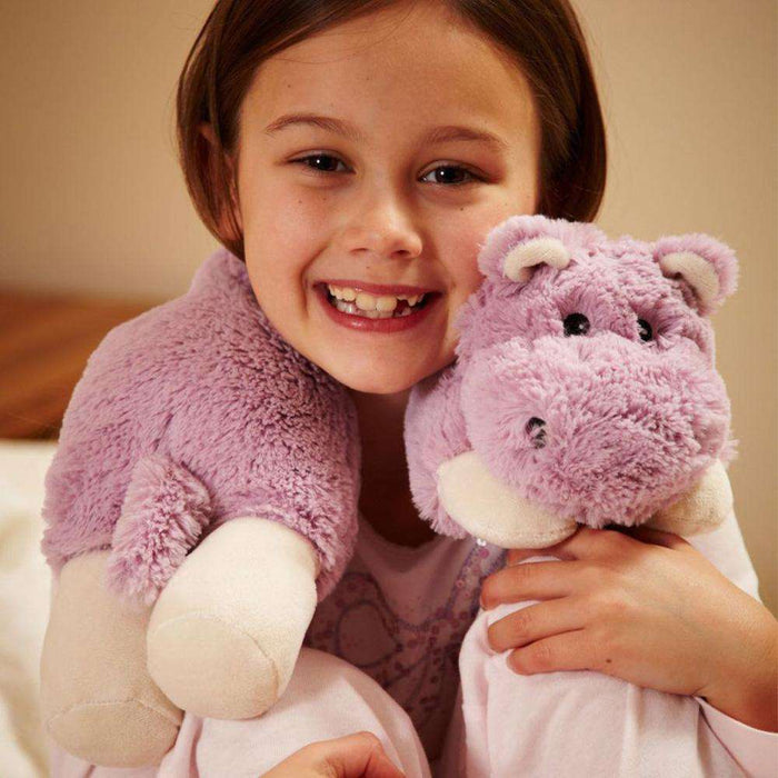 Child smiling while wearing Soft Cozy Hippo Wrap Stuffed Animal Warmies