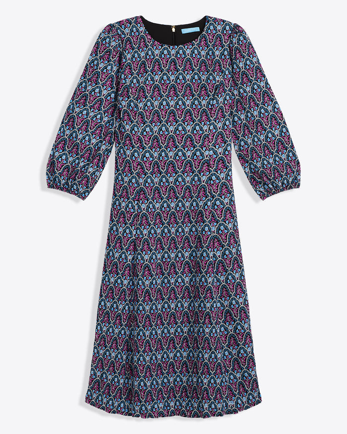The Draper James Long-Sleeve Midi Dress features a knee-length crinkle chiffon design with multicolored paisley in blue, pink, and black, plus a crewneck and slightly puffed sleeves.