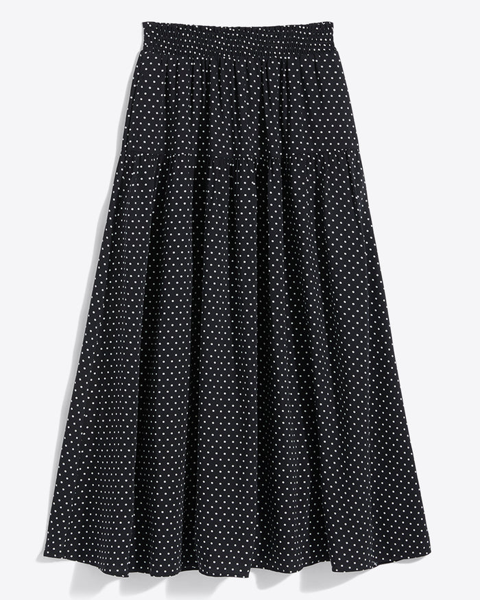 The Draper James Midi Skirt in Polka Dot features a black base with white dots, an ankle-length cut, and a comfy smocked waist for easy wear.