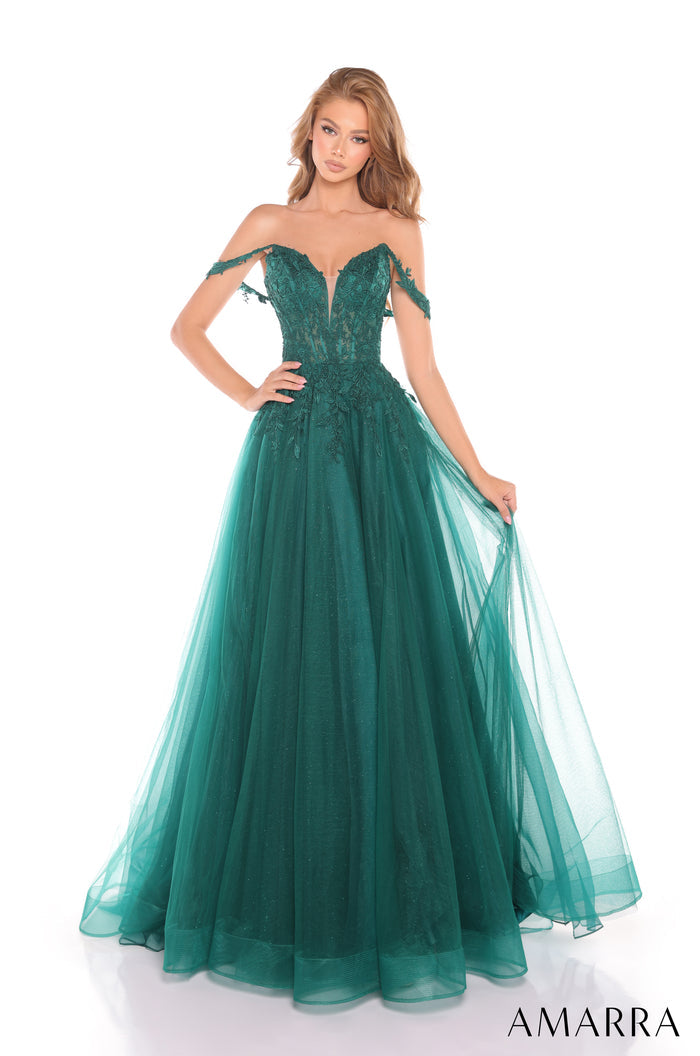 An off-shoulder emerald gown with lace bodice and flowing tulle skirt, styled on a model against a white background.