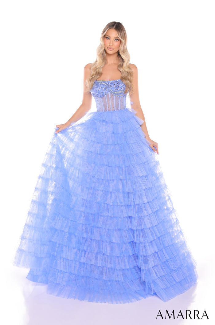 A model wears a periwinkle tiered ballgown with a corseted bodice and flowing ruffled skirt.