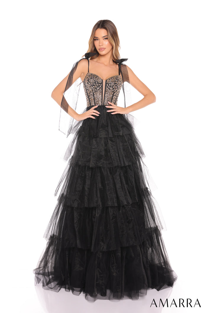 A Black/Gold tiered tulle ball gown with a beaded corset bodice and sweeping ruffled skirt.