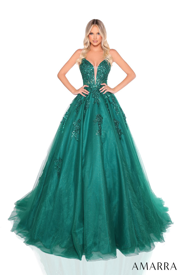 A floor-length emerald ball gown with sequined bodice and full tulle skirt, posed against a white background.
