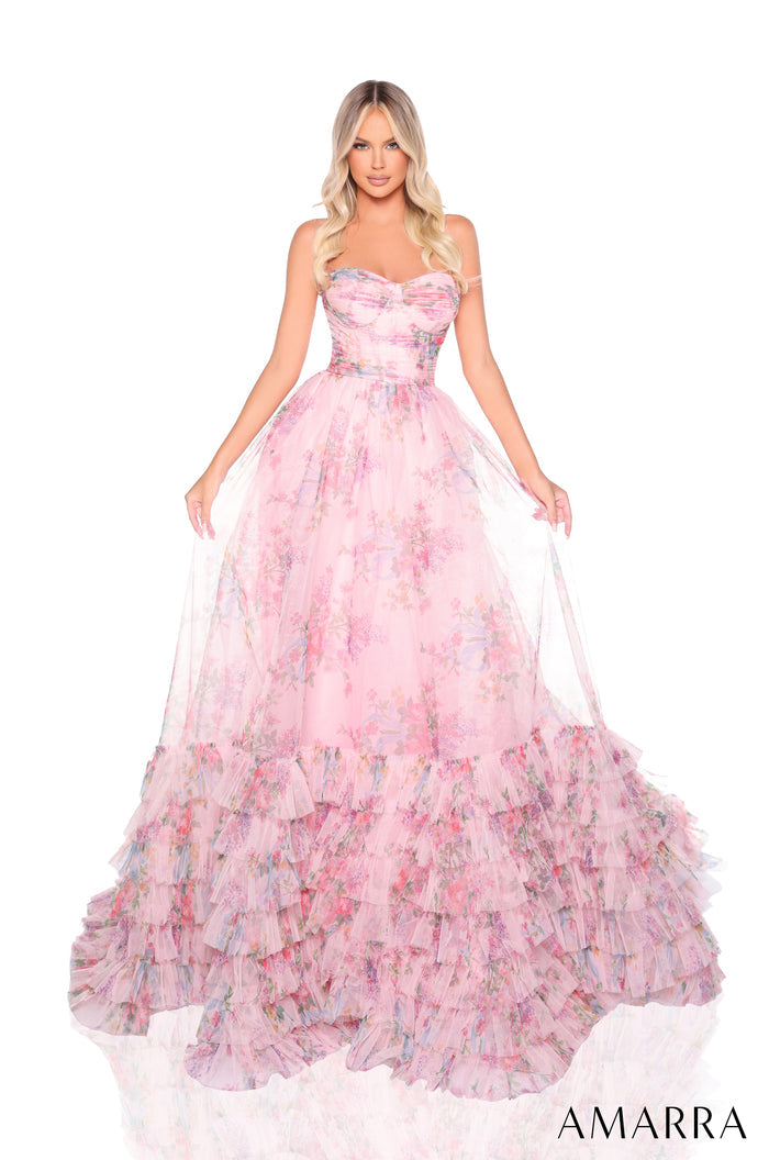 A flowing ball gown in Blush/Multi features a strapless bodice and multi-tiered ruffled skirt with floral print.