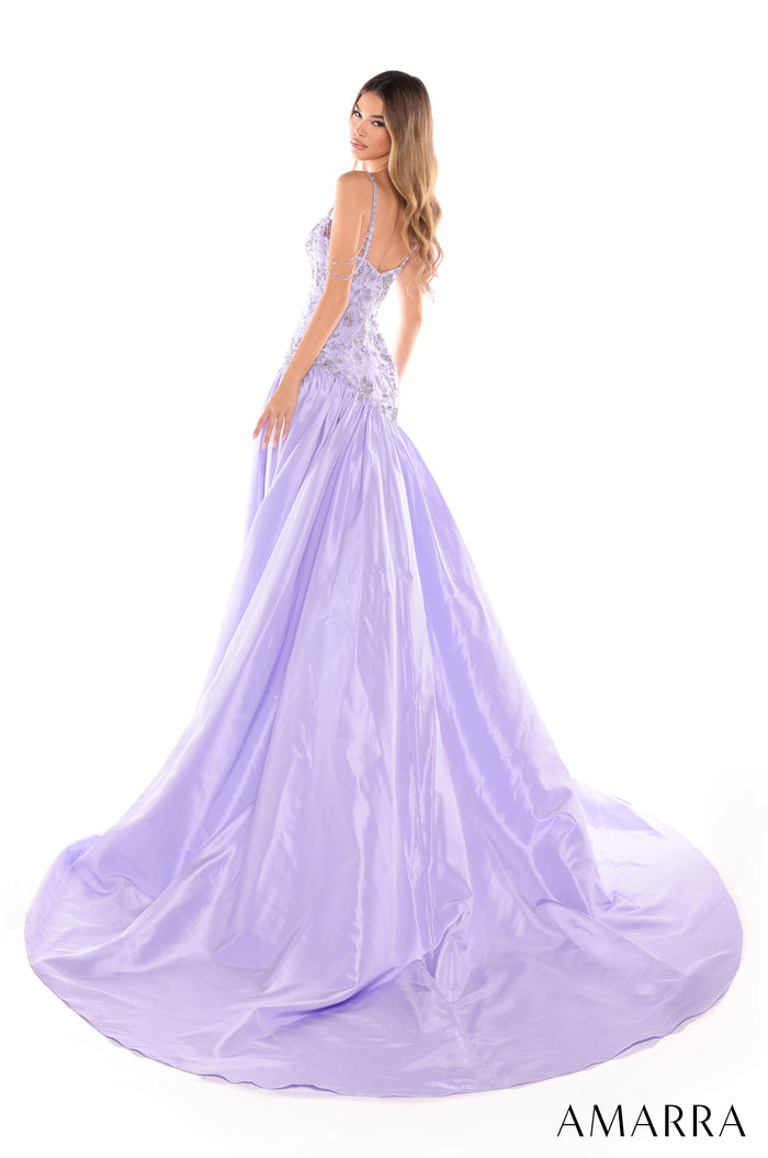 A lavender ball gown with intricate beaded bodice and a voluminous flowing skirt, styled from behind.