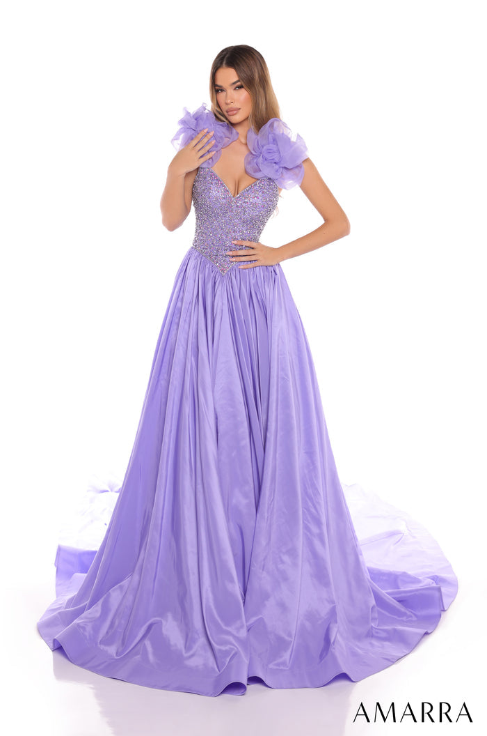 A person wears a lavender floor-length gown with sequined bodice and dramatic ruffled shoulders.