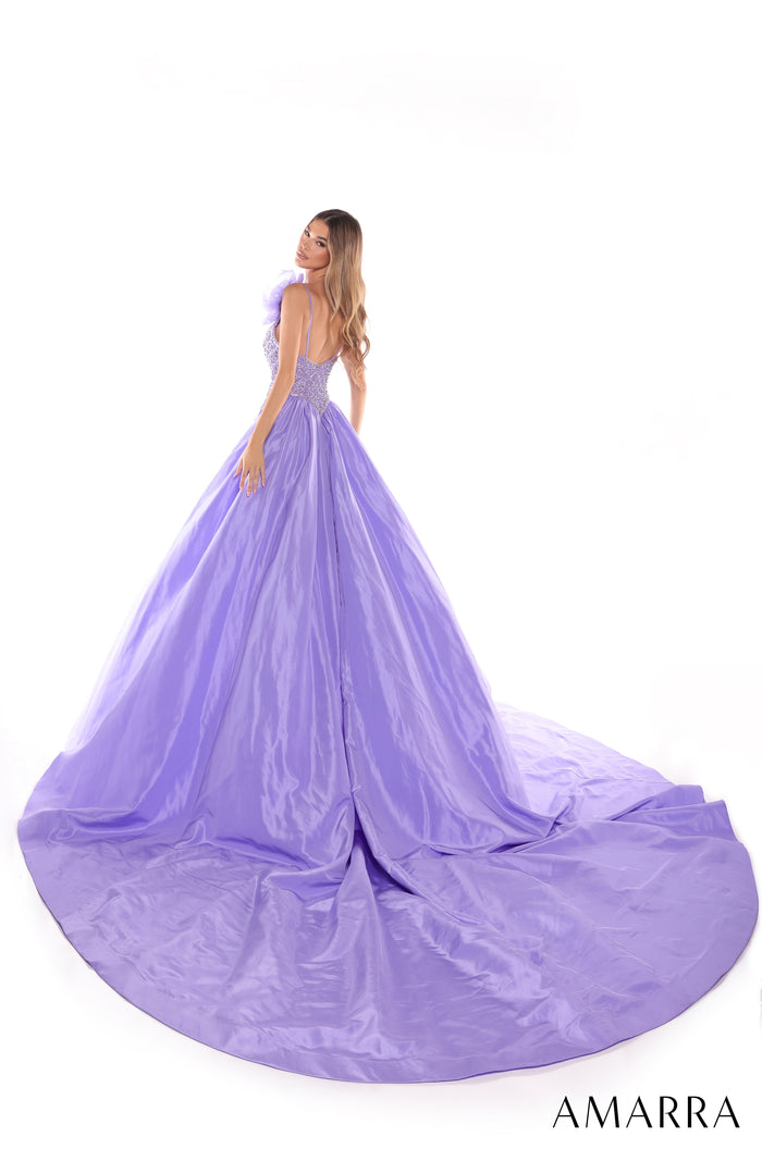 A lavender ballgown with a beaded bodice and voluminous skirt, worn by a model facing away on a white background.