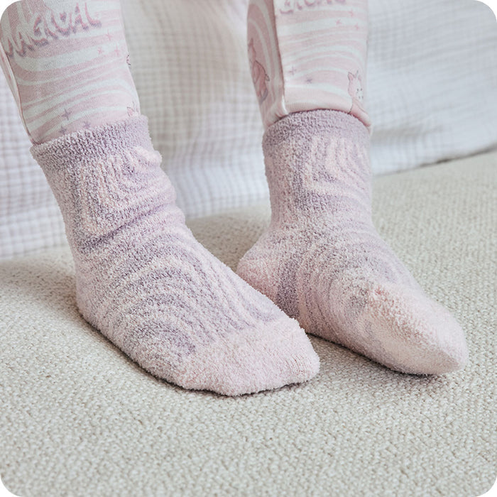 pink unicorn socks on kids feet